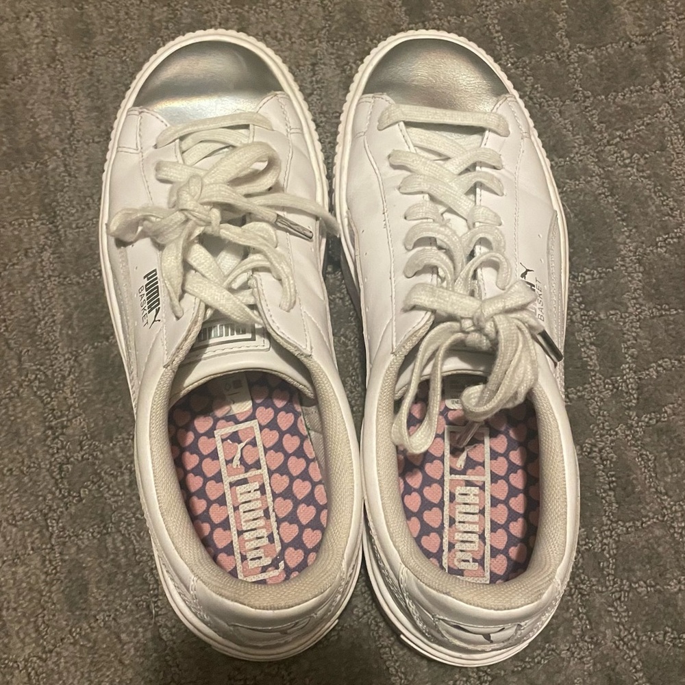 White and silver white Puma sneakers
